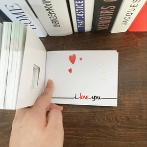 Flipbook with a hidden engagement ring compartment